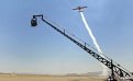 The crew filming an aerobatic performance by pilot Greg Poe at Reno's Stead Field Airport (Nevada) using a crane-mounted 3D camera rig